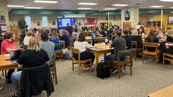 Staff together in library